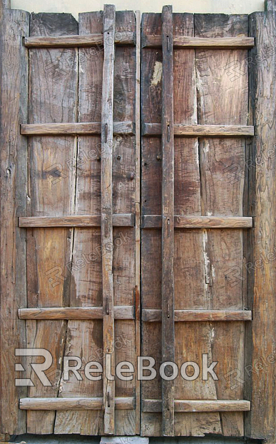 A rustic wooden door with a natural, textured surface, featuring a simple metal handle and hinge, set against a shadowy background. The wood's grain and knots are prominently displayed, adding character to the door.