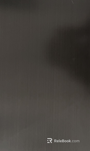 Dark gray brushed metal wall paneling texture