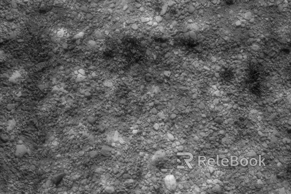 The image depicts a close-up of gravel, showcasing an assortment of small, irregularly shaped stones with various hues of gray, brown, and black, set against a contrasting light background.